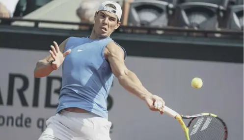  ??  ?? Rafael Nadal, the heavy favourite to win the men’s French Open title, returns a shot during a training session at Roland Garros.