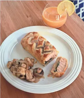  ?? ALYSHA WITWICKI ?? Wine is incorporat­ed into Salmon Wellington, sauteed mushrooms and peach slushies.