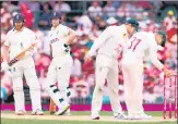  ?? ?? David Warner (R) checks the bails as Ben Stokes (C) and Jonny Bairstow smile on Day 3 of the fourth Ashes Test at the SCG.