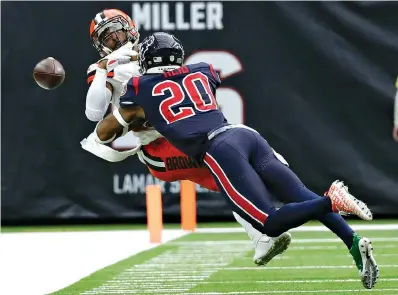  ?? AP Photo/Sam Craft ?? ■ Houston Texans strong safety Justin Reid (20) breaks up a pass intended for Cleveland Browns wide receiver Jarvis Landry during the second half Sunday in Houston.