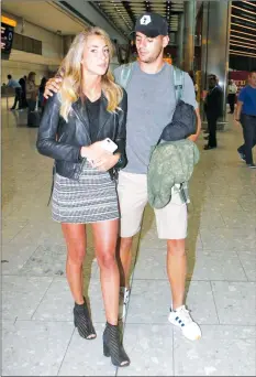  ?? - The Mirror ?? BEAUTY AND THE BEAST . . . Spanish soccer striker Alvaro Morata (right) arrives at Heathrow Airport in London with his wife Alice Campello yesterday ahead of his move to English Premiershi­p champions Chelsea.