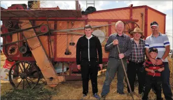  ??  ?? Peter Murray, Michael O’ Driscoll, Michael O’ Callaghan, Peter Murray Jnr, and Padraig Murray, Carrignava­r keeping the Thresher going at the Castletown­roche Vintage Rally.