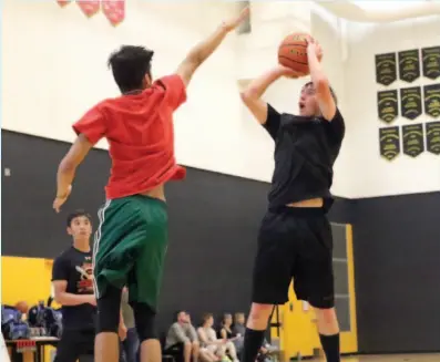  ?? CITIZEN FILE PHOTO ?? Ajay Nickolet puts up a shot against defender Raymon Dhillion during the 2017 Summer Hoops Classic 3-on-3 high school basketball tournament. This year’s event is June 9 at Duchess Park.