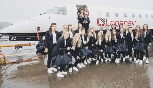  ??  ?? 0 Coach Shelley Kerr and her Scotland squad about to board a flight to France where they will take part in the World Cup finals for the first time.