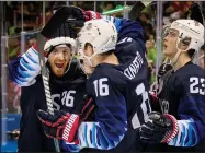  ?? CARLOS GONZALEZ/TRIBUNE NEWS SERVICE ?? Team USA's Ryan Donato (16) celebrates with teammates after scoring a goal in the third period against Slovakia on Tuesday at Gangneung Hockey Centre in South Korea.