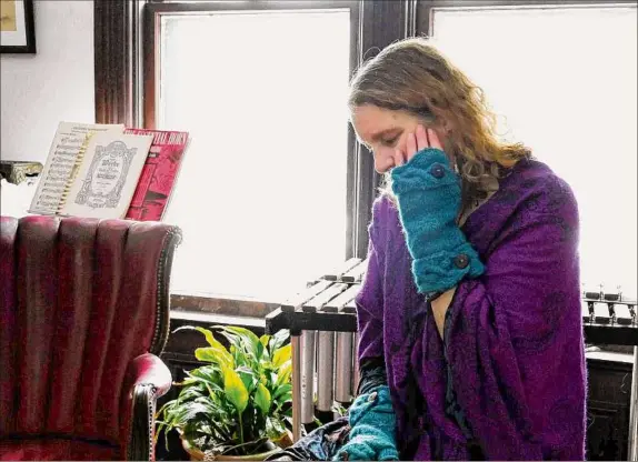  ?? Photos by Will Waldron / Times Union ?? MarieAnn Cherry, at her home in Cambridge, has been fighting the village since 2020, when it replaced all of its streetligh­ts with LED lights. Lights near her home have been backdated with convention­al bulbs. A diagnosis letter from Cherry’s former doctor, which states that she has photosensi­tive epilepsy, does not sufficient­ly demonstrat­e that LEDs are causing her seizures, according to Mayor Carman Bogle and the village Board of Trustees.