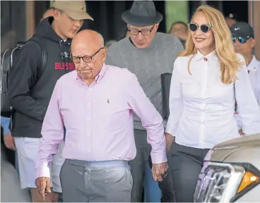  ?? /Bloomberg ?? Media mogul: Rupert Murdoch, co-chairman of Twenty-First Century Fox, and wife Jerry Hall in Idaho, US, on Tuesday. Murdoch has been trying to buy Sky for some time and if the deal goes through, it is expected to be approved by the British government...