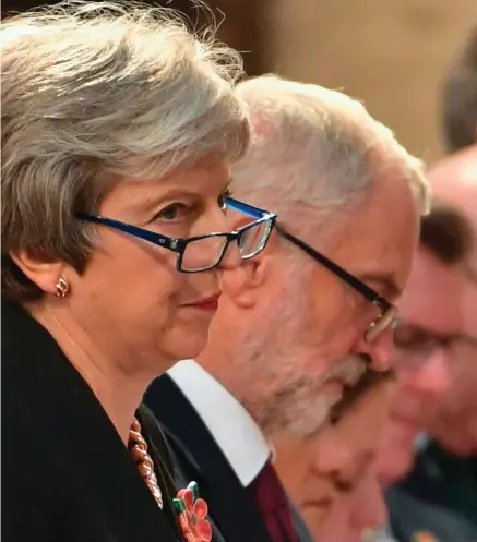  ?? PHOTO: GETTY ?? Leaked memo: British Prime Minister Theresa May and Labour leader Jeremy Corbyn at a remembranc­e service at St Margaret’s church in Westminste­r yesterday.