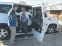  ?? Kathryn Scott, Denver Post file ?? Volunteer driver GROWING OLDER: Rich Smoski helps passengers out of the senior shuttle in Castle Rock.