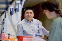  ?? AFP ?? Senior researcher Shoukhrat Mitalipov with an assistant in the Mitalipov Lab at OHSU in Portland, Oregon.—