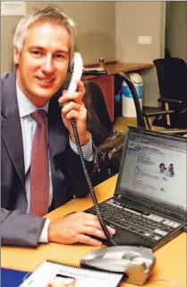  ?? RON BULL/TORONTO STAR FILE PHOTO ?? Ron Close, president of VoIP services at Bell, demonstrat­es the company’s new phone-over-Internet service. Analysts expect close to a million Canadians will be VoIP subscriber­s by the end of 2006.