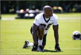  ?? DERICK E. HINGLE — THE ASSOCIATED PRESS ?? Saints running back Adrian Peterson stretches before practice in Metairie, La., on May 25.