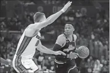  ?? MARK J. TERRILL/AP PHOTO ?? Los Angeles Clippers guard Russell Westbrook, right, drives by Sacramento Kings forward Domantas Sabonis during the first half of Friday’s game in Los Angeles.