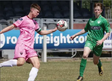  ??  ?? Kyle Scallan of Wexford about to control the ball as John Carmody (Kerry) looks on.