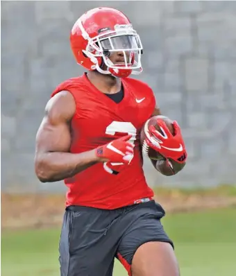  ?? GEORGIA PHOTO/STEVEN COLQUITT ?? Georgia redshirt freshman running back Zamir White earned the praise of coach Kirby Smart for his performanc­e during Saturday’s scrimmage, the Bulldogs’ first this preseason.