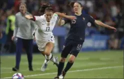  ?? FRANCISCO SECO — THE ASSOCIATED PRESS ?? United States’ Alex Morgan, left, vies with France’s Elise Bussaglia for the ball during the Women’s World Cup quarterfin­al soccer match at the Parc des Princes in Paris on Friday.