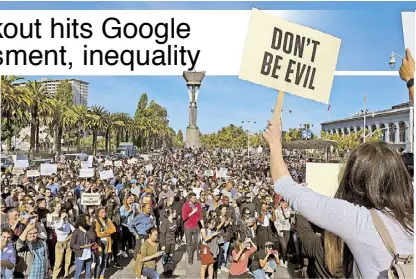  ?? AP ?? Google employees fill Harry Bridges Plaza in front of the Ferry Building during a walkout in San Francisco on Thursday. Carrying signs with messages such as ‘Don’t be evil,’ hundreds of Google employees around the world briefly walked off the job Thursday in a protest against what they said is the tech company’s mishandlin­g of sexual misconduct allegation­s against executives.