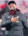  ??  ?? All smiles: Jurgen Klopp shows his delight at Pool’s progress