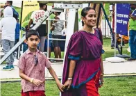  ??  ?? A sri Lankan mother and son in traditiona­l attire at Zaabeel Park.