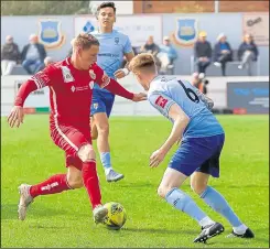  ?? Picture: Les Biggs ?? Whitstable striker Charlie Heatley turns inside past Lancing’s Liam Hendy on Saturday