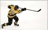  ?? Charles Krupa / Associated Press ?? Boston Bruins center Patrice Bergeron, 36, is a four-time Selke Trophy winner and a finalist for the award 10 straight years.