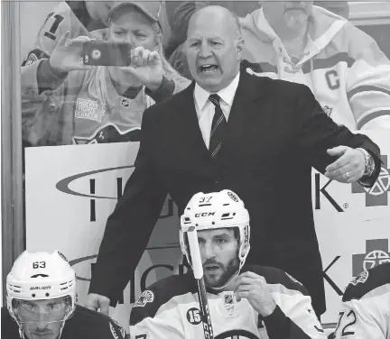  ?? GENE J. PUSKAR/THE ASSOCIATED PRESS ?? Claude Julien, who recently parted ways with the Boston Bruins, could be a top candidate to serve as Team Canada’s head coach at the Pyeongchan­g Winter Olympic Games next February — but that might depend on whether NHL players participat­e or not.