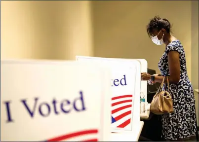  ?? (Arkansas Democrat-Gazette/Stephen Swofford) ?? Antoinette Henderson casts her ballot Monday on the last day of early voting for the Little Rock sales tax at the Pulaski County Regional Building.