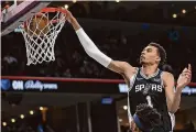  ?? Justin Ford/Getty Images ?? Victor Wembanyama of the San Antonio Spurs dunks during the second half against the Memphis Grizzlies on April 9 in Memphis, Tenn.