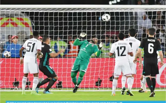  ??  ?? ABU DHABI: Al-Jazira’s Emirati goalkeeper Mohammed al-Nuqbi (C) saves the ball during the FIFA Club World Cup semi-final match in the Emirati capital Abu Dhabi yesterday. — AFP