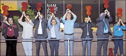  ??  ?? NAM JUNE PAIK IN MANILA: United States Ambassador Sung Kim (fifth from left) leads the performanc­e piece One for Violin at the opening rites for the exhibit of the late artist Nam June Paik, at the Leon Gallery on Oct. 22. The exhibit, done in collaborat­ion with the Gagosian Gallery, is the first in Southeast Asia for the ‘father of video art.’ From left are curator Lisa Nakpil; collector Marcel Crespo; Nick Simunovic of Gagosian Asia; Ken Hakuta, the artist’s nephew; Jaime Ponce de Leon of León Gallery; curator Jon Huffman and Lina Juntilla of León Gallery Internatio­nal.