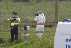  ??  ?? SCENE: Gardai and forensic officers at scene in Dunleer