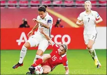  ??  ?? Russia’s forward Elena Danilova (down) tackles Germany’s midfielder Dzsenifer Marozsan during the UEFA Women’s Euro 2017 football match between Russia and Germany at Galgenwaar­d Stadium in Utrecht on July
25. (AFP)