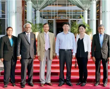  ??  ?? Pictured above is the Minister Tao along with Ms. Pang Chunxue, Political Counsellor of the Chinese Embassy and the BMICH team.