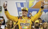  ?? STEVE HELBER - THE ASSOCIATED PRESS ?? Kyle Busch (18) celebrates winning the NASCAR Cup Series auto race in victory lane at Richmond Raceway in Richmond, Va., Saturday, Sept. 22, 2018.