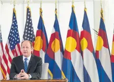  ??  ?? Gov. Jared Polis tells Coloradans he is extending his stay-at-home order until April 26 during an address Monday from the governor’s mansion.