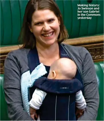  ??  ?? Making history: Jo Swinson and her son Gabriel in the Commons yesterday