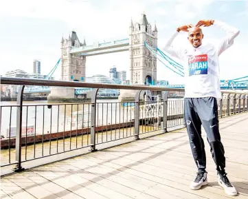  ?? — AFP photo ?? Britain’s Mo Farah poses for the media during a photo call for the London marathon near Tower Bridge in London on April 17, 2018.