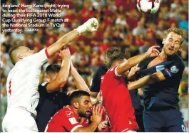  ??  ?? England’ Harry Kane (right) trying to head the ball against Malta during their FIFA 2018 World Cup Qualifying Group F match at the National Stadium in Ta’Qali yesterday. –