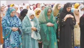  ?? AP photo ?? American Muslims women pray to mark the end of the holy month of Ramadan at Petree Hall in Los Angeles on Wednesday. As the war in Gaza enters its seventh month, some Muslim and Arab American leaders have grown frustrated with outreach from President Joe Biden’s White House. The fractured relationsh­ip could jeopardize the Democratic president’s reelection campaign and help pave the way for Republican Donald Trump to return to the White House.