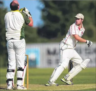  ?? Pictures: Martin Apps FM4814578, left; FM4814570 ?? Left, Faversham keeper Nick Bentley shows his anguish at a near miss with Betteshang­er’s Matthew Smart at the crease during Saturday’s Division 5 game at Deal Right, Ahmed Safi bowling for Faversham