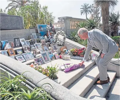  ?? Picture: PA. ?? Prince Charles lays flowers at the memorial to the victims of the terror attack in Nice.