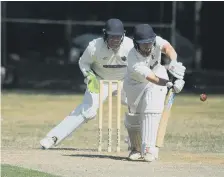  ?? ?? Whitburn batsman Lee Henderson goes on the defence.