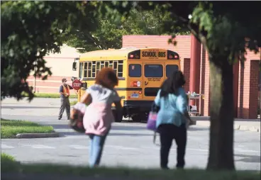  ?? Tyler Sizemore / Hearst Connecticu­t Media ?? Students enter school on the first day of the 2020-21 school year at Westover Elementary School in Stamford on Sept. 8. The district hosted a virtual meeting with parents this week to discuss recent shooting incidents near the school and describe the school’s safety protocols.