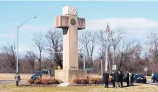  ?? KEVIN WOLF/ASSOCIATED PRESS ?? Visitors walk around the Maryland Peace Cross in February in Bladensbur­g, Maryland. The Supreme Court ruled the World War I memorial can continue to stand on public land.