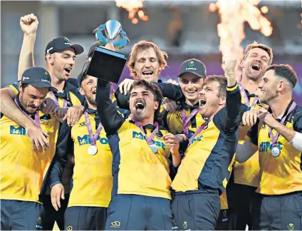  ??  ?? Leading from front: Kiran Carlson holds aloft the Royal London One-day Cup as Glamorgan celebrate victory over Durham at Trent Bridge