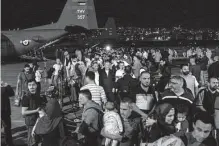  ?? Khalil Mazraawi//tribune News Service ?? Evacuees from Sudan arrive at a military airport in Amman, Jordan, on Monday. A stream of military aircraft flew into Sudan all day Sunday and Monday to take foreigners out.