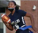  ?? ?? Amplus receiver Tiana Moore runs with the ball during flag football practice as the team gets ready for the season.