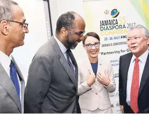  ?? RUDOLPH BROWN/ PHOTOGRAPH­ER ?? Earl Jarrett (second left), chairman of the preparator­y committee for the Jamaica 55 Diaspora Conference, speaks with Senator Kamina Johnson Smith, minister of foreign affairs and foreign trade; Gary Hendrickso­n (right), chairman of Continenta­l Baking...