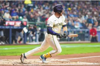  ?? ASSOCIATED PRESS ?? Milwaukee Brewers’ Oliver Dunn hits a single during the second inning of a baseball game against the Minnesota Twins on Tuesday in Milwaukee.