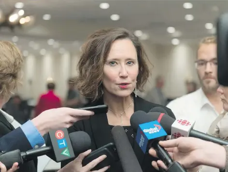  ?? MICHAEL BELL ?? Education Minister Bronwyn Eyre speaks to reporters in Regina on Tuesday about the controvers­y surroundin­g her recent comments on treaty education. By late Tuesday evening, hundreds of people had signed an online petition calling for Eyre to quit or be fired over her statements.